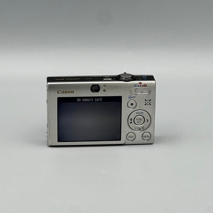 Rear view of a silver Canon PowerShot SD770 IS showing its LCD screen, viewfinder and circular control pad