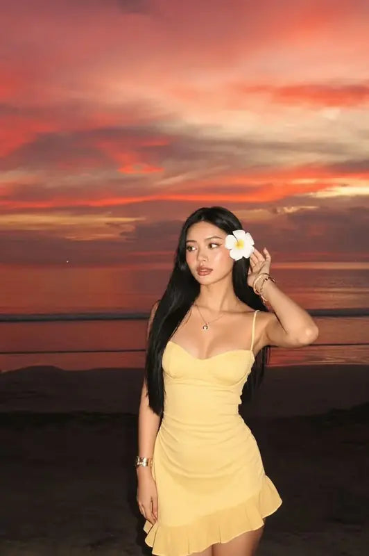 A direct-flash portrait at a colorful beach sunset