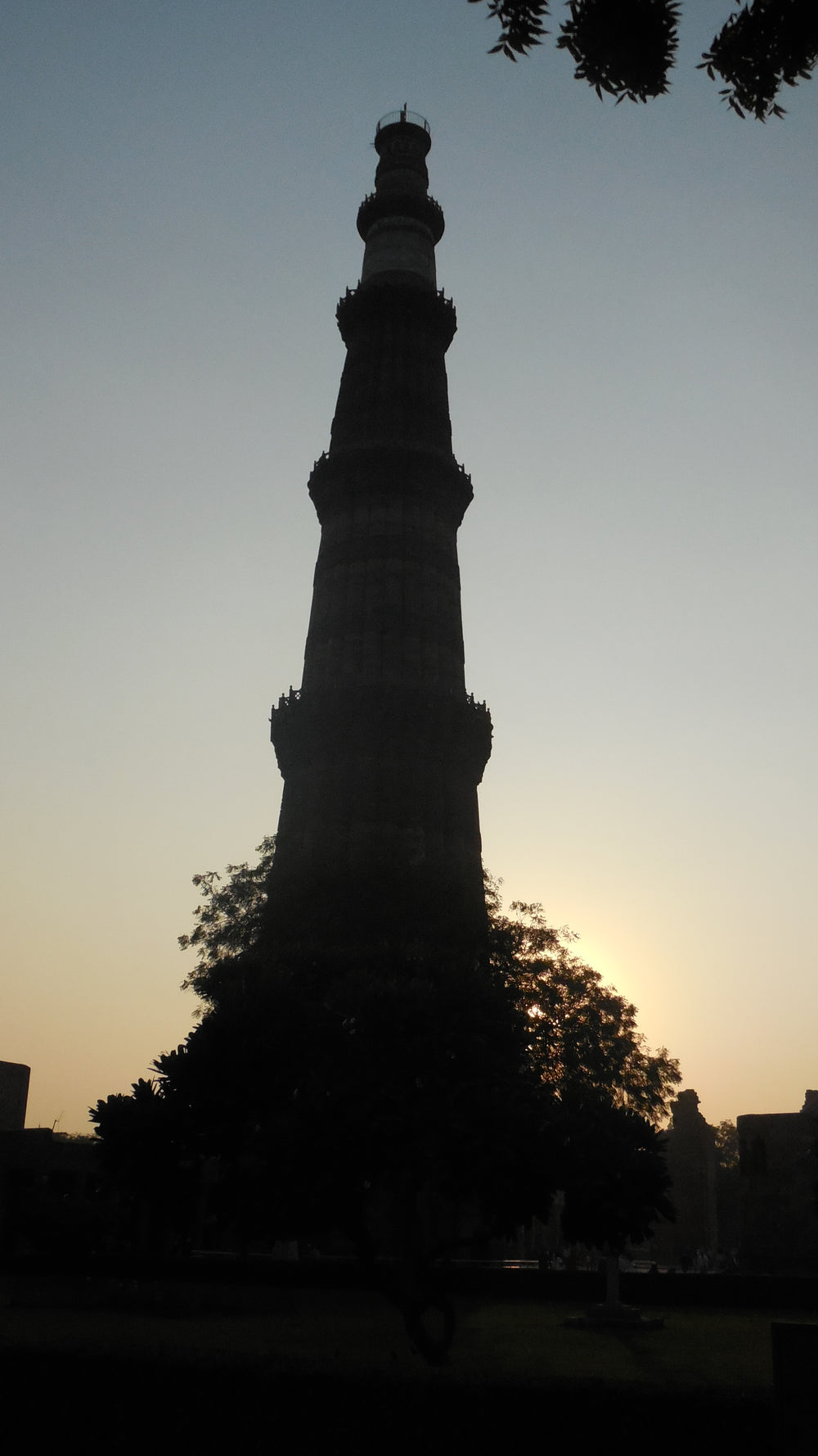 Qutb Minar silhouette at dusk