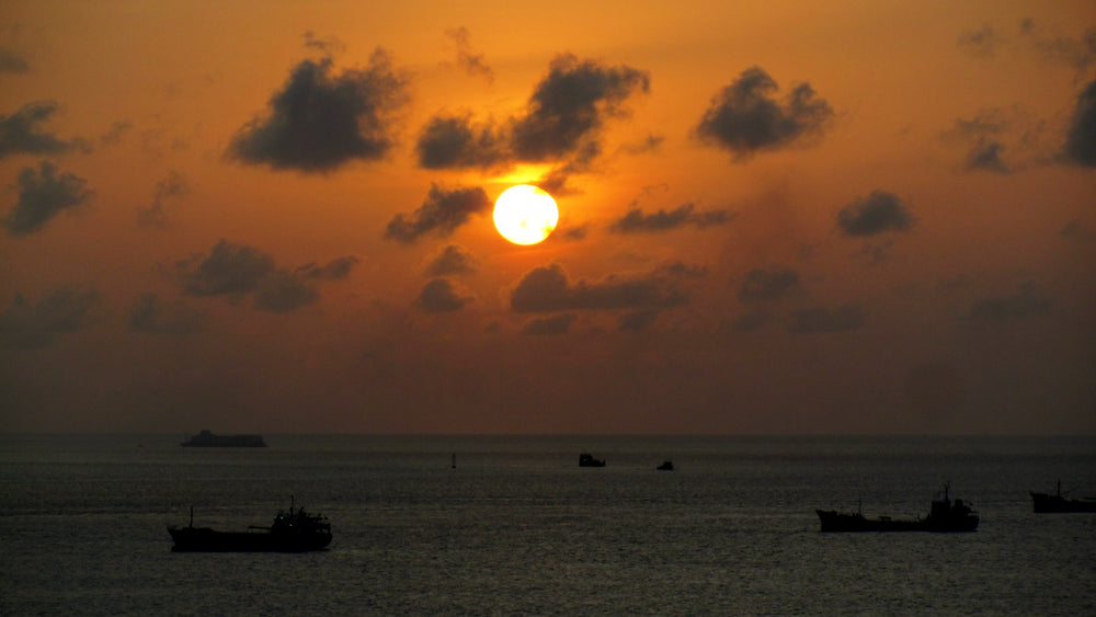 Orange sunset over Malé harbor