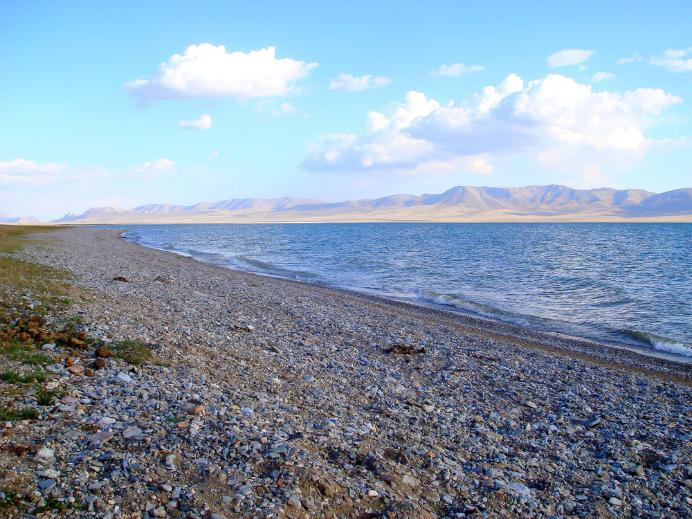 Blue lake and pebble shore