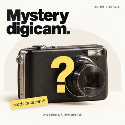 Mystery Digicam product artwork with an anonymous black camera and yellow question mark on an ivory background, a pale arch and yellow Ready to Shoot label